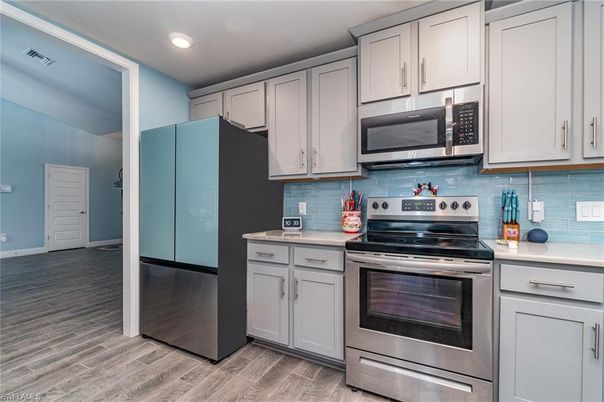 Interior, Kitchen, Recessed Lighting, Stainless Steel Appliances, Wood Texture Flooring