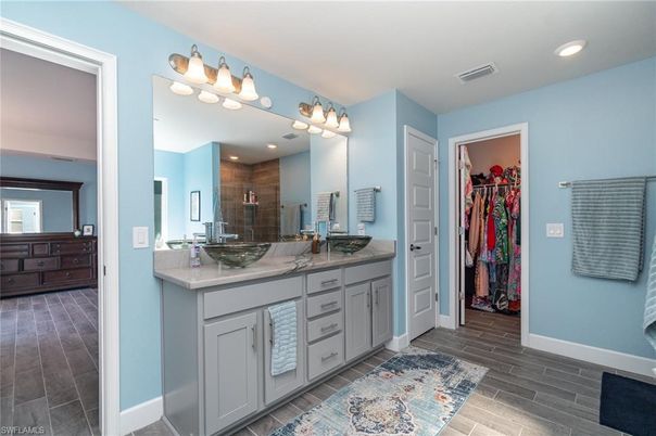 Bathroom, Dual Sink Vanities, Interior, Recessed Lighting, Wood Texture Flooring
