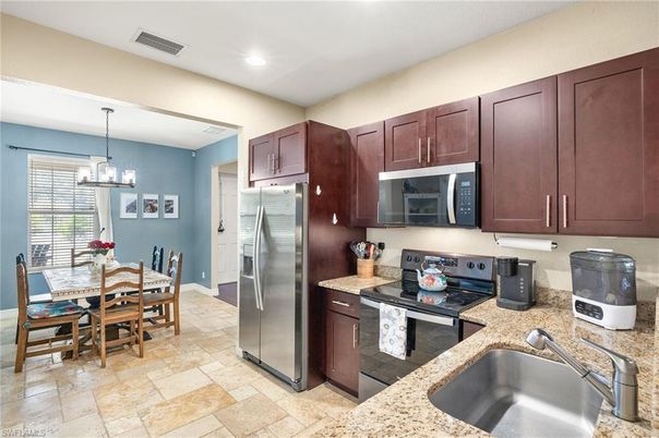 Chandelier, Dining room, Interior, Kitchen, Pendant Lights, Recessed Lighting, Stainless Steel Appliances