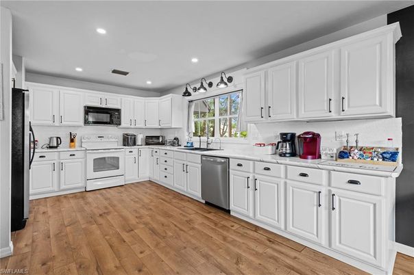 Interior, Kitchen, Recessed Lighting, Stainless Steel Appliances, Wood Texture Flooring
