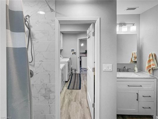 Bathroom, Interior, Marble Walls, Washer, Wood Texture Flooring