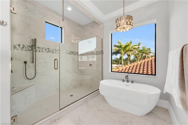 Bathroom, Free Standing Baths, Glass Shower, Interior, Marble, Marble Walls, Pendant Lights, Recessed Lighting