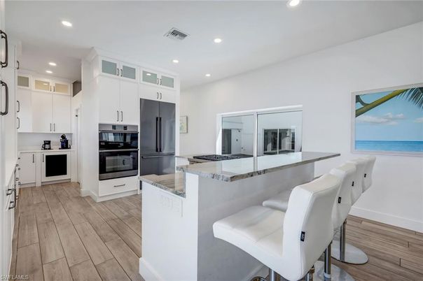 Interior, Kitchen, Recessed Lighting, Stainless Steel Appliances, Water, Wood Texture Flooring
