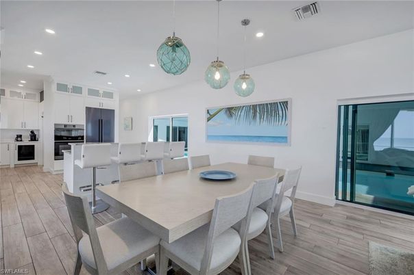 Dining room, Interior, Kitchen, Pendant Lights, Recessed Lighting, Stainless Steel Appliances, Wood Texture Flooring