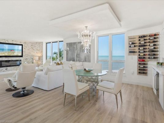 Chandelier, Dining room, Interior, Living room, Stone Walls, Water, Wine Storage, Wood Texture Flooring