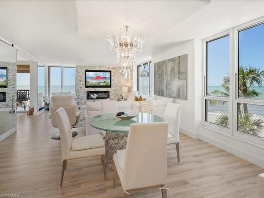 Chandelier, Dining room, Fireplace, Interior, Living room, Stone Walls, Wood Texture Flooring