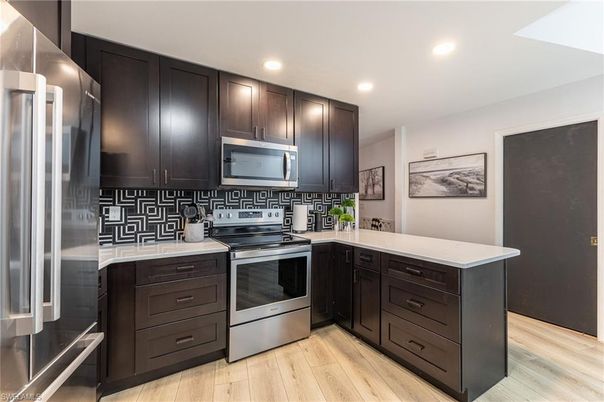 Interior, Kitchen, Recessed Lighting, Stainless Steel Appliances, Wood Texture Flooring