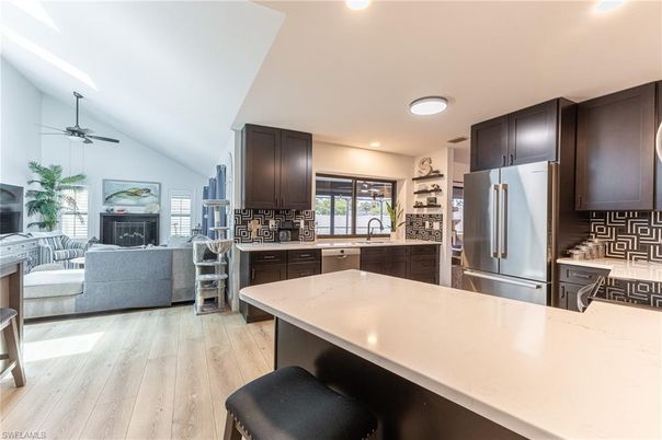 Fireplace, Interior, Kitchen, Living room, Recessed Lighting, Wood Texture Flooring
