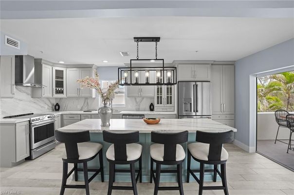 Interior, Kitchen, Marble Walls, Pendant Lights, Recessed Lighting, Stainless Steel Appliances, Wood Texture Flooring