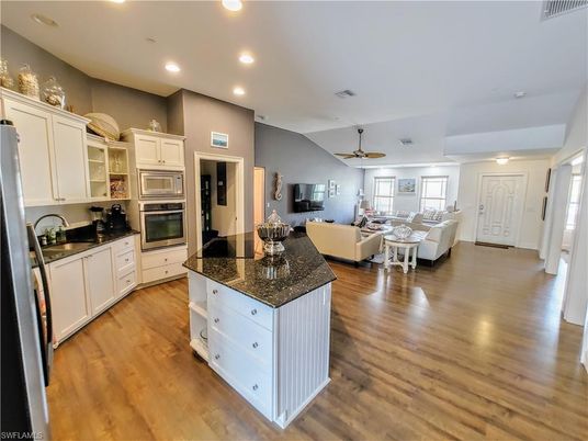 Dining room, Interior, Kitchen, Living room, Recessed Lighting, Stainless Steel Appliances, Wood Texture Flooring