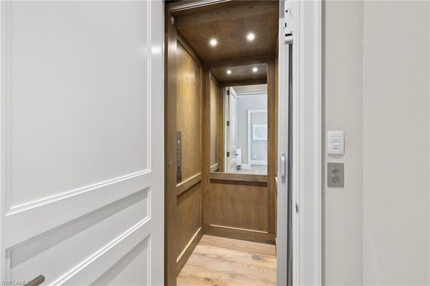 Elevator, Interior, Recessed Lighting, Wooden Ceilings, Wood Texture Flooring, Wooden Walls