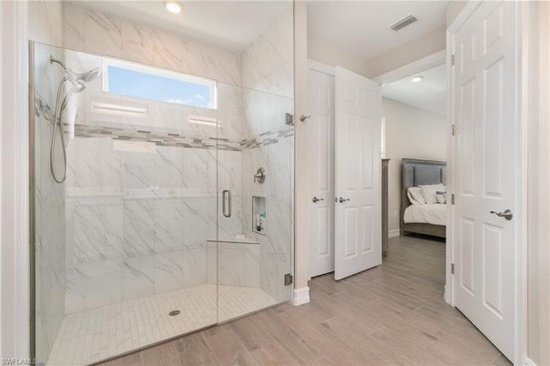 Bathroom, Bedroom, Glass Shower, Interior, Marble Walls, Recessed Lighting, Wood Texture Flooring