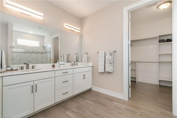Bathroom, Dual Sink Vanities, Interior, Marble Walls, Walk-in Closets, Wood Texture Flooring