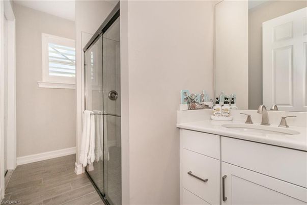 Bathroom, Dual Sink Vanities, Glass Shower, Interior, Wood Texture Flooring