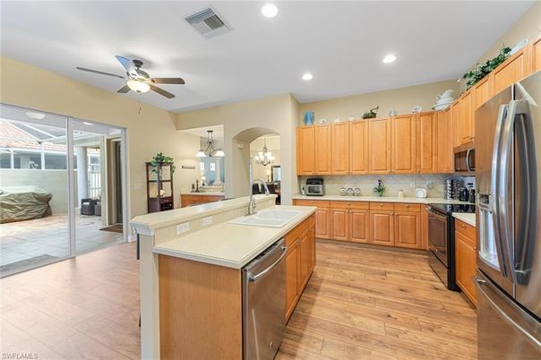 Chandelier, Interior, Kitchen, Recessed Lighting, Stainless Steel Appliances, Wood Texture Flooring