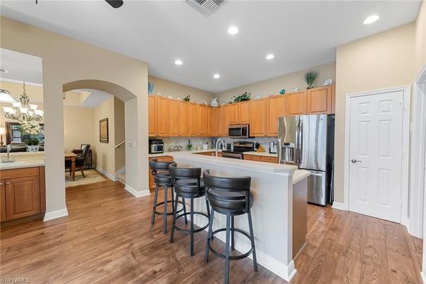 Chandelier, Dining room, Interior, Kitchen, Recessed Lighting, Stainless Steel Appliances, Wood Texture Flooring