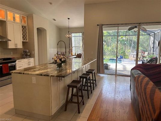 Chandelier, Interior, Kitchen, Recessed Lighting, Stainless Steel Appliances, Wood Texture Flooring