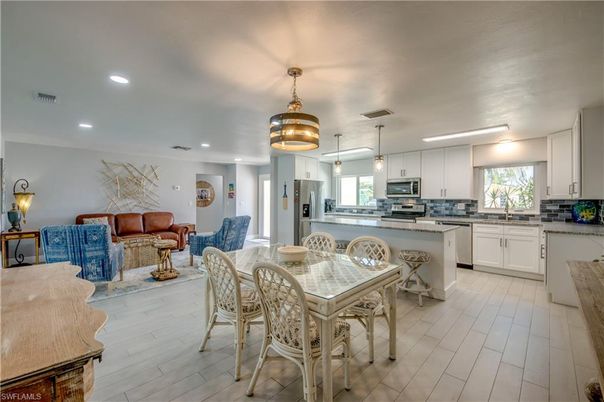 Dining room, Interior, Kitchen, Living room, Pendant Lights, Recessed Lighting, Stainless Steel Appliances, Wood Texture Flooring