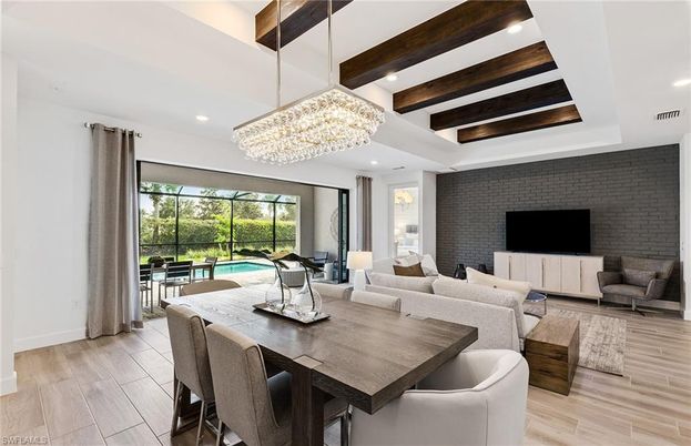 Chandelier, Dining room, Interior, Living room, Recessed Lighting, Stone Walls, Wooden Beams, Wood Texture Flooring
