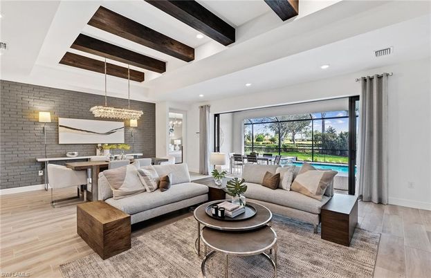 Chandelier, Dining room, Interior, Living room, Pendant Lights, Recessed Lighting, Stone Walls, Wooden Beams, Wood Texture Flooring