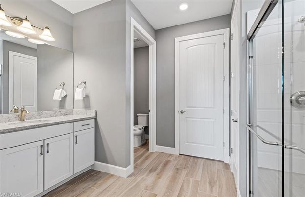 Bathroom, Glass Shower, Interior, Recessed Lighting, Wood Texture Flooring