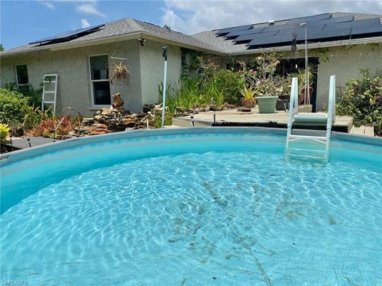 Exterior, Pool, Solar Panels