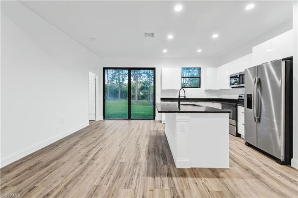 Interior, Kitchen, Recessed Lighting, Stainless Steel Appliances, Wood Texture Flooring