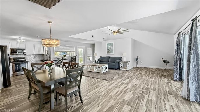 Dining room, Interior, Kitchen, Living room, Pendant Lights, Stainless Steel Appliances, Wood Texture Flooring