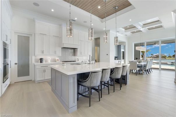 Dining room, Interior, Kitchen, Pendant Lights, Recessed Lighting, Stainless Steel Appliances, Water, Wooden Ceilings, Wood Texture Flooring