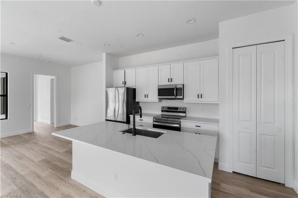 Interior, Kitchen, Recessed Lighting, Stainless Steel Appliances, Wood Texture Flooring