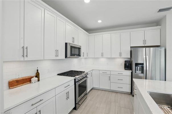 Interior, Kitchen, Recessed Lighting, Stainless Steel Appliances, Wood Texture Flooring