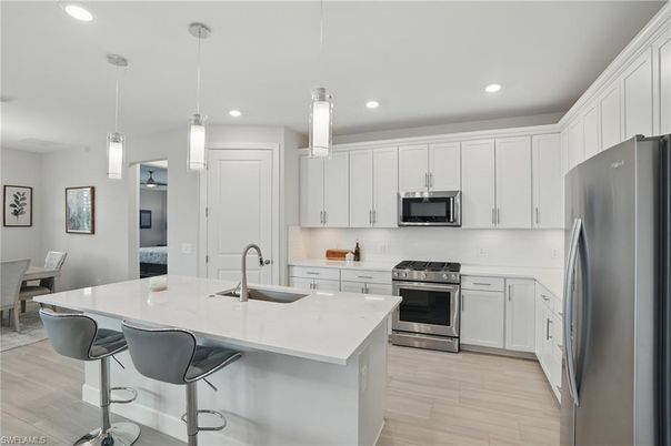 Interior, Kitchen, Pendant Lights, Recessed Lighting, Stainless Steel Appliances, Wood Texture Flooring