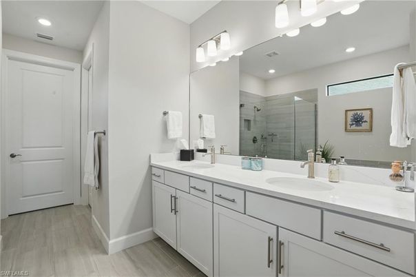 Bathroom, Dual Sink Vanities, Glass Shower, Interior, Recessed Lighting, Wood Texture Flooring