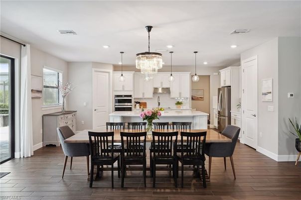 Dining room, Interior, Kitchen, Pendant Lights, Recessed Lighting, Stainless Steel Appliances, Wood Texture Flooring
