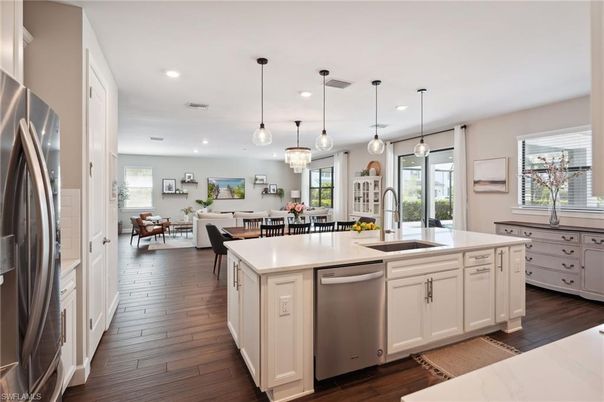 Chandelier, Dining room, Interior, Kitchen, Pendant Lights, Recessed Lighting, Stainless Steel Appliances, Wood Texture Flooring