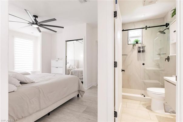 Bathroom, Bedroom, Glass Shower, Interior, Marble Walls, Recessed Lighting, Wood Texture Flooring