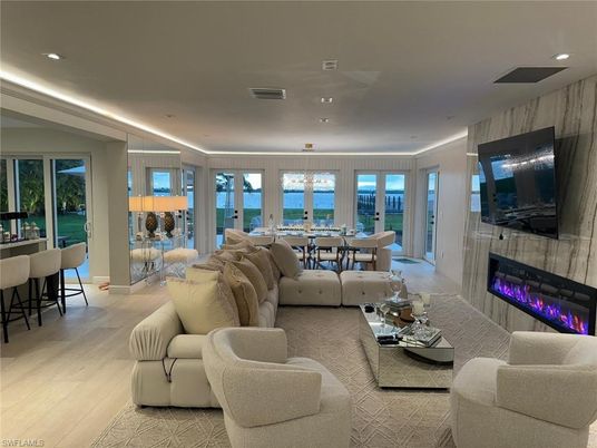 Dining room, Fireplace, Interior, Living room, Recessed Lighting, Water, Wood Texture Flooring