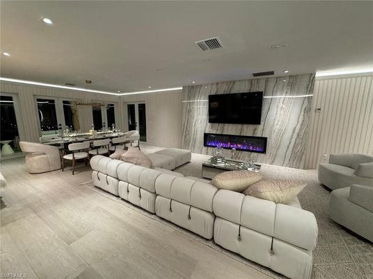 Dining room, Fireplace, Interior, Living room, Marble Walls, Recessed Lighting, Wood Texture Flooring