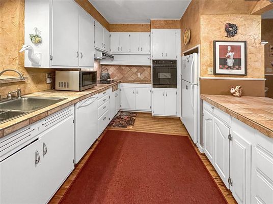 Interior, Kitchen, Tile Countertops, Wood Texture Flooring