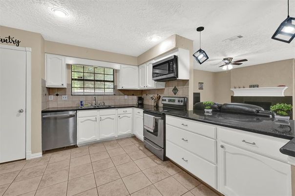 Fireplace, Interior, Kitchen, Pendant Lights, Recessed Lighting, Stainless Steel Appliances