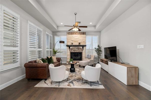 Fireplace, Interior, Living room, Recessed Lighting, Stone Walls, Wood Texture Flooring