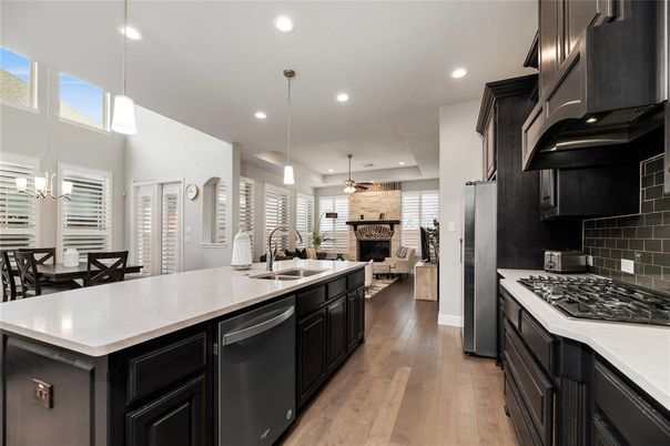 Dining room, Fireplace, Interior, Kitchen, Living room, Pendant Lights, Recessed Lighting, Stainless Steel Appliances, Stone Walls, Wood Texture Flooring