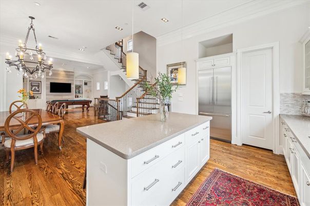Chandelier, Dining room, Interior, Kitchen, Pendant Lights, Recessed Lighting, Stainless Steel Appliances, Wood Texture Flooring
