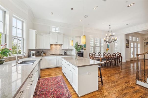 Chandelier, Dining room, Interior, Kitchen, Pendant Lights, Recessed Lighting, Stainless Steel Appliances, Wood Texture Flooring