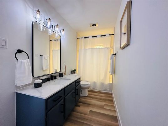 Bathroom, Dual Sink Vanities, Interior, Recessed Lighting, Wood Texture Flooring