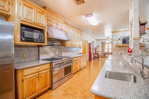 Dining room, Interior, Kitchen, Stainless Steel Appliances, Stone Walls, Wood Texture Flooring