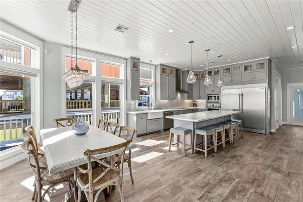 Dining room, Interior, Kitchen, Pendant Lights, Recessed Lighting, Stainless Steel Appliances, Wood Texture Flooring