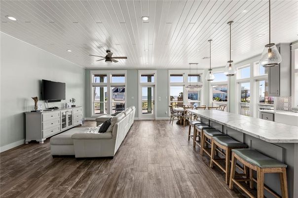 Dining room, Fireplace, Interior, Living room, Pendant Lights, Recessed Lighting, Wood Texture Flooring