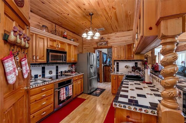 Chandelier, Interior, Kitchen, Tile Countertops, Wooden Ceilings, Wood Texture Flooring