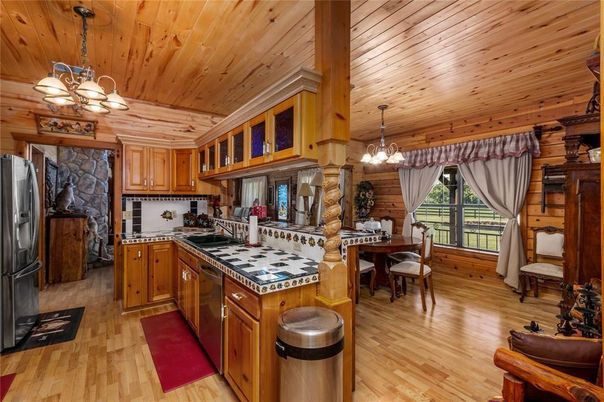 Chandelier, Dining room, Interior, Kitchen, Pendant Lights, Tile Countertops, Wooden Ceilings, Wood Texture Flooring